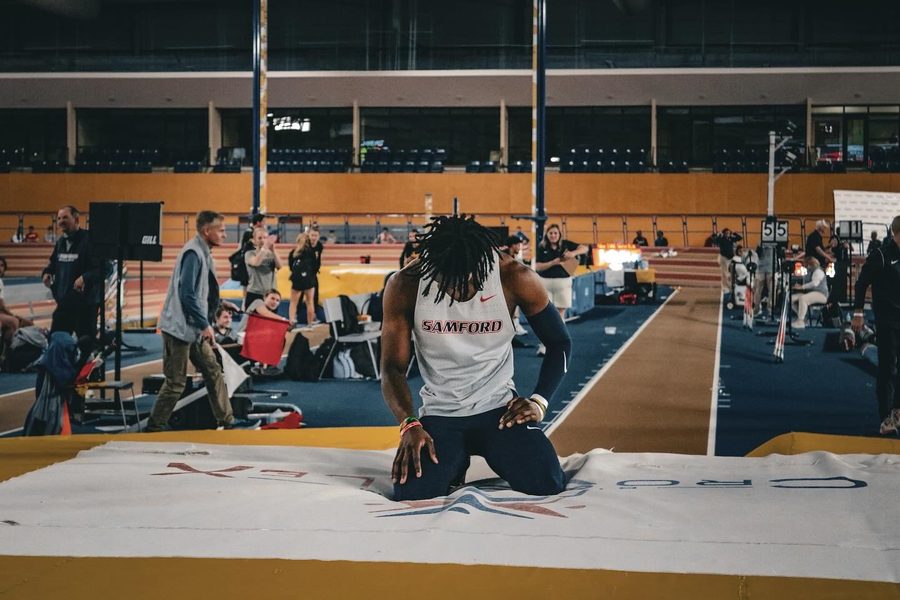 Brenden Vanderpool kneeling on the pit at Samford