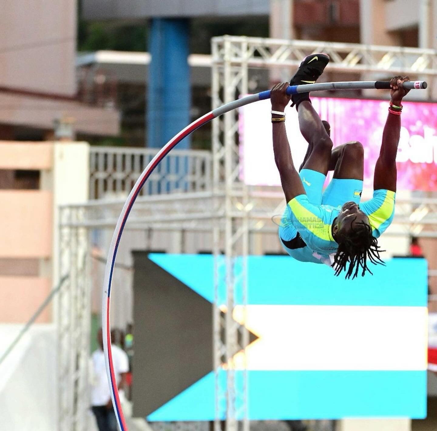 Brenden Vanderpool clearing the bar in Bahamas colors