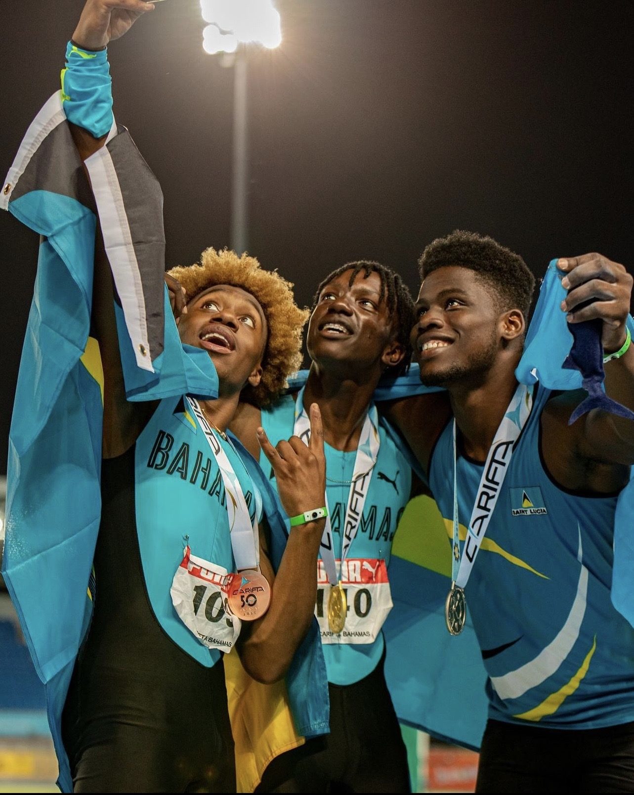 Brenden Vanderpool celebrating with the Bahamas flag