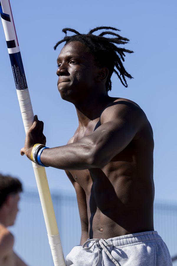Brenden Vanderpool holding the pole, looking down the runway