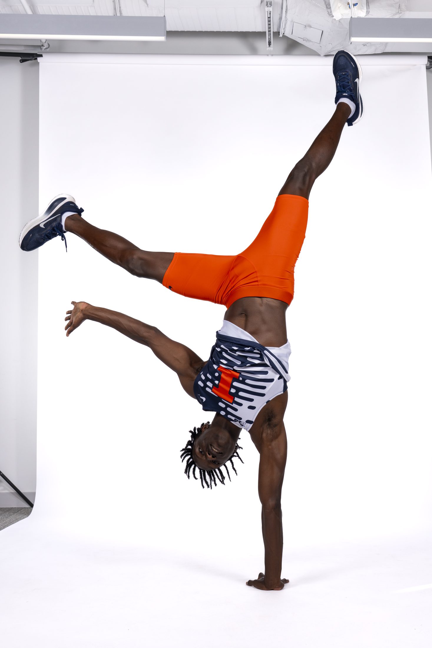 Brenden Vanderpool doing a handstand in the studio