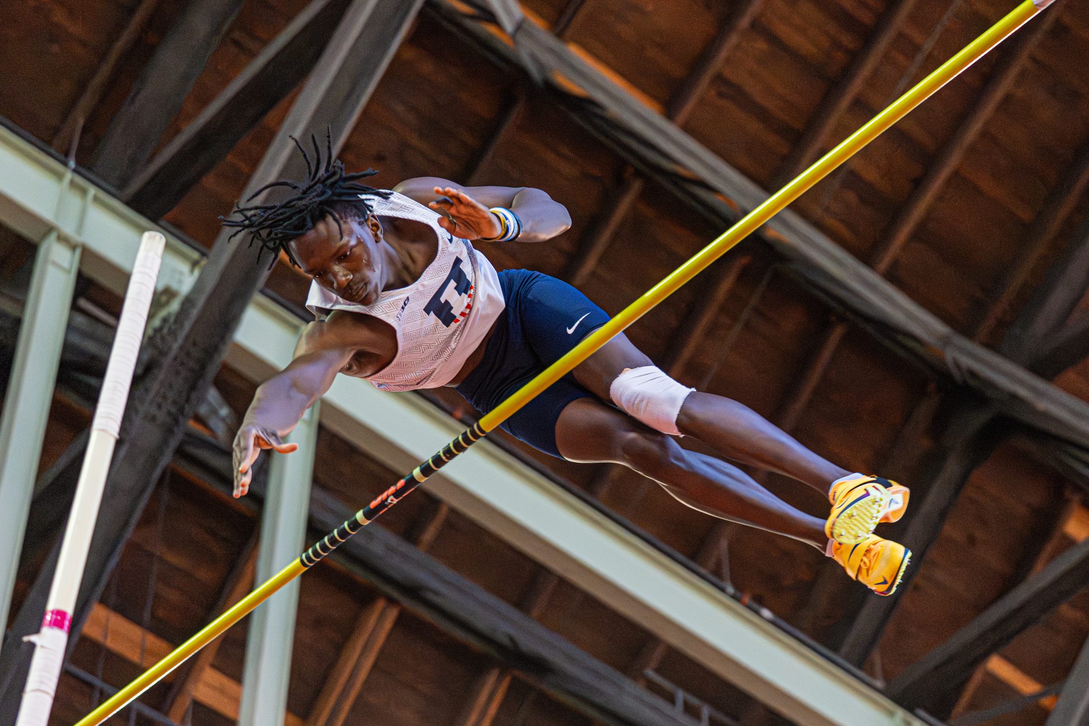 Brenden Vanderpool over the bar at the Illinois Armory