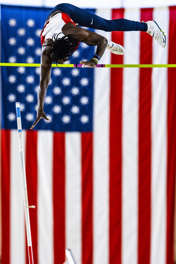 Brenden Vanderpool clearing the bar in front of the flag, UAB 2025